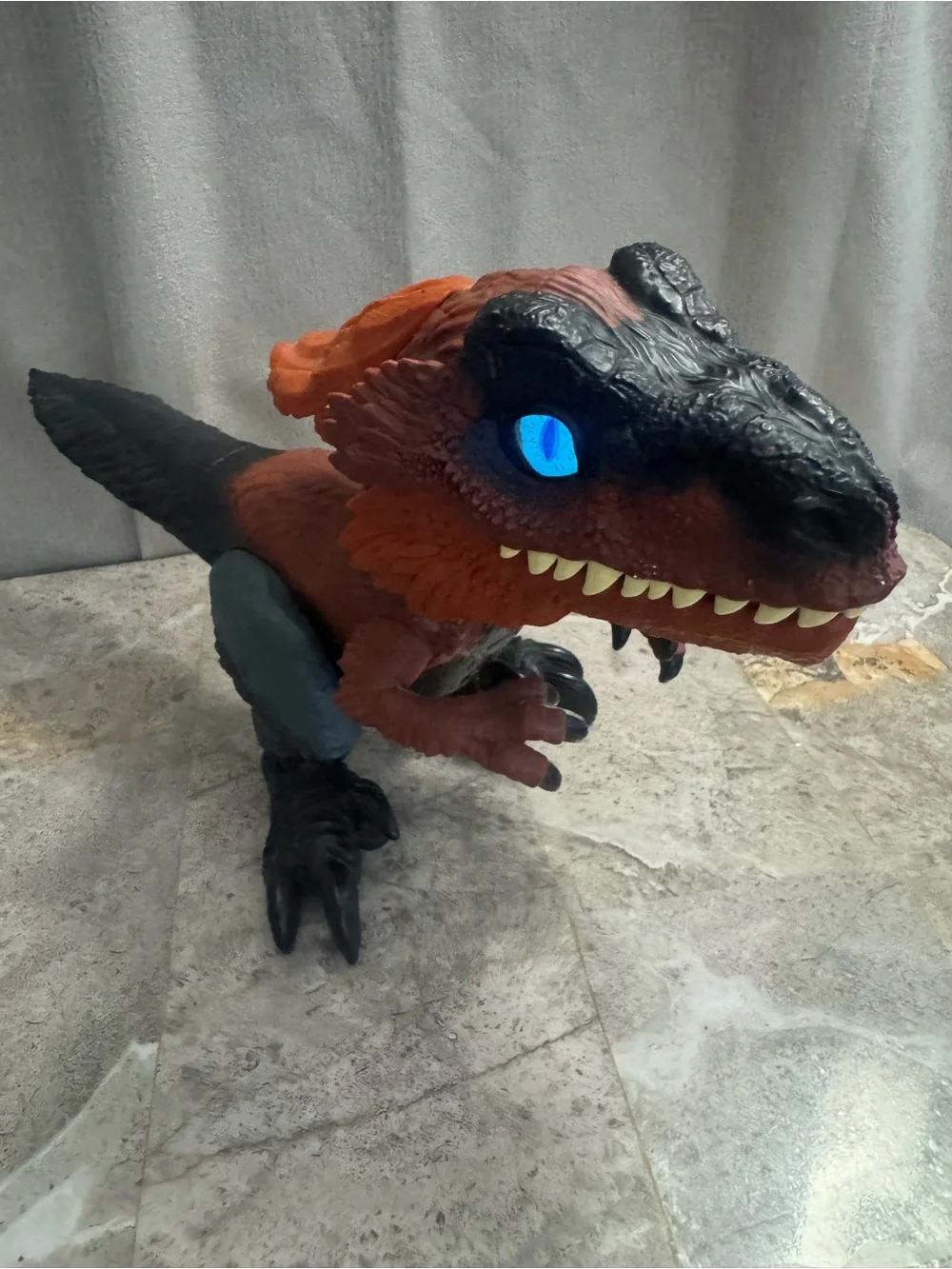 Red and Black Interactive Reptile Toy with Glowing Eye